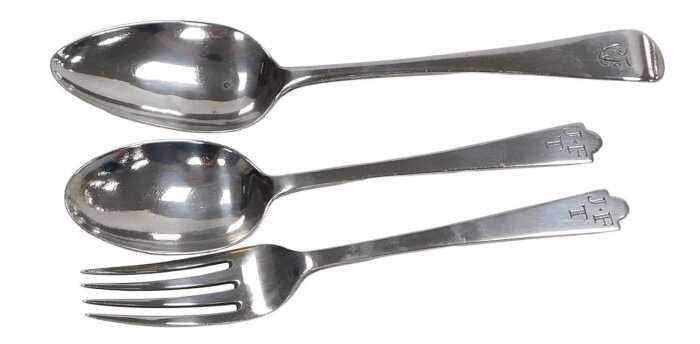An Elizabeth II silver trefid child's fork and spoon set, monogram engraved, cased, London 1960,...