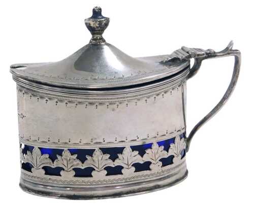 A Victorian silver mustard pot, of oval form, with a hinged lid, and a band of pierced repeating...