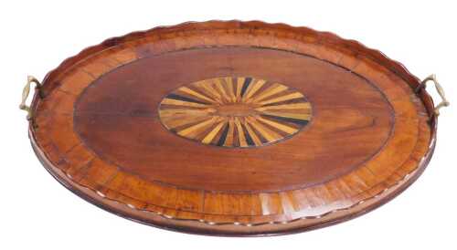 A George III mahogany and brass twin handled tray, with yew and rosewood crossbanding and an...