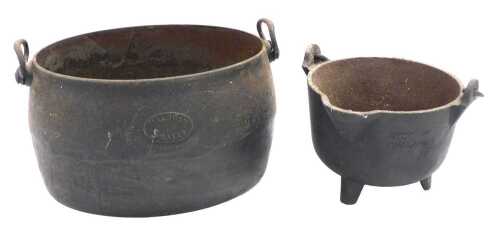 An early 20thC Baldwin three gallon cast iron cauldron, together with a cast iron smelting pot,...