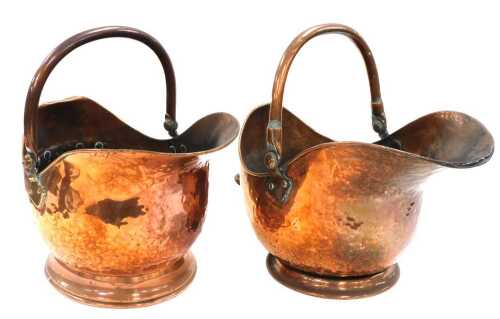 Two Victorian helmet shaped coal scuttles, each 42cm wide.