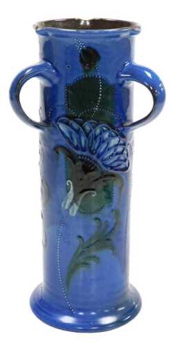 An early 20thC CH Brannam Barum triple handled vase, of cylindrical form, slip and tube line...