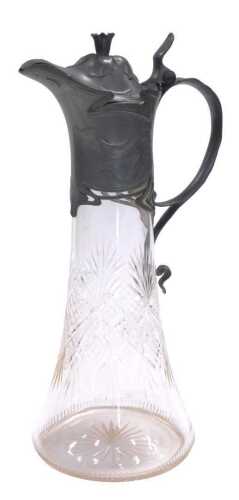 An early 20thC Juventa Art Nouveau cut glass and pewter mounted claret jug, with a hinged lid...