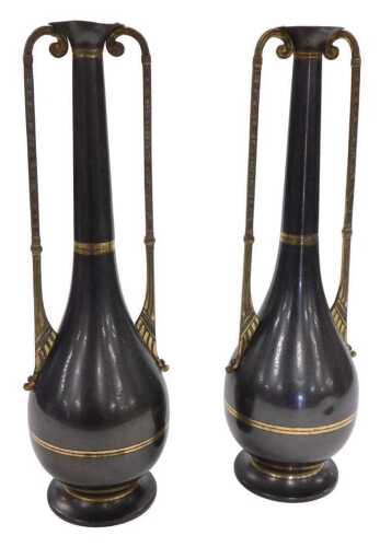 A pair of early 20thC KMD Daalderop Egyptian style copper and brass vases, of twin handled...