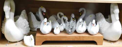 A collection of swan planters or bowls, in plastic, crystal and ceramic, sizes ranging from 8cm...