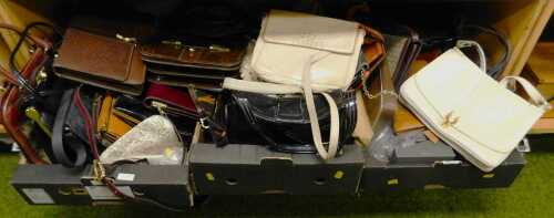 A group of handbags, with examples in patent leather, ostrich leather, snake skin, beaded, etc....