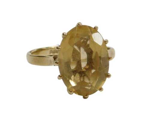 A 9ct gold and citrine ring, the oval cut citrine in a basket setting, size M&frac12;, 3.5g.