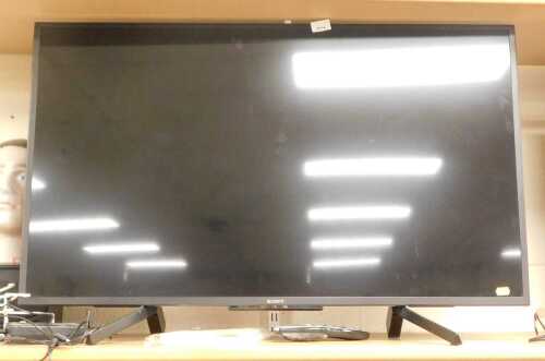 A Sony 42" television, model number KDL-43WG683, with lead and remote.
