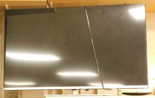 A Mitchell and Brown 43" television with lead and remote.