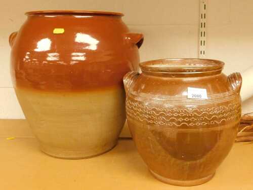 A two tone stoneware twin handled jar, of cylindrical taper and form, 43cm high, together with a...