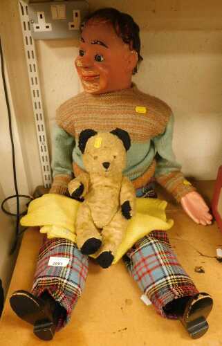 A ventriloquist's doll, wearing a knitted jumper and tartan trousers, approx 89cm high, together...