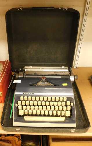 An Addler Gabriele 35 typewriter, cased together with a Roberts radio.