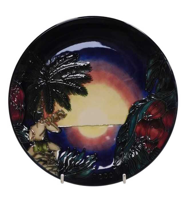 A Moorcroft pottery Birth of Light 2000 year plate, limited edition 145/2000, painted and...