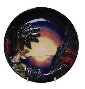 A Moorcroft pottery Birth of Light 2000 year plate, limited edition 145/2000, painted and...