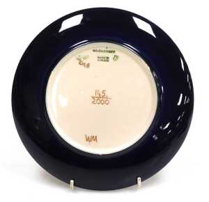 A Moorcroft pottery Birth of Light 2000 year plate, limited edition 145/2000, painted and... - 2