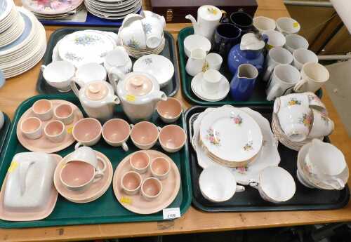 A Poole pottery two tone pink and grey part coffee and teawares, together with further part...