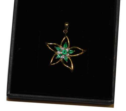 A 9ct gold emerald and diamond floral pendant, for Gems TV, with certificate, boxed, metal...