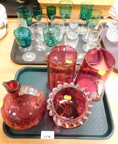 Victorian cranberry glassware, to include jugs, together with green tinted drinking glasses, etc....