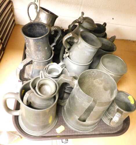 A group of pewter, to include pewter half pint tankards, pewter pint tankards, pewter lidded...