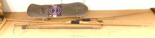 V - A pair of long bows, 170cm long, together with a livewood walking stick, and a Zorlac Skate...