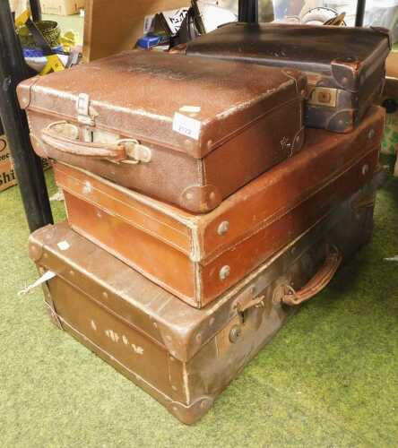 V - A group of leather suitcases, the largest 18cm high, 60cm wide, 37cm deep, the smallest 12cm...