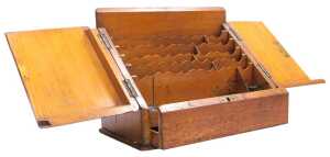 A Victorian oak stationery box, with sloping hinged doors opening to reveal a waterfall fitted...