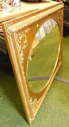 A Victorian style giltwood framed rectangular wall mirror, inset with an oval glass plate, 78cm...