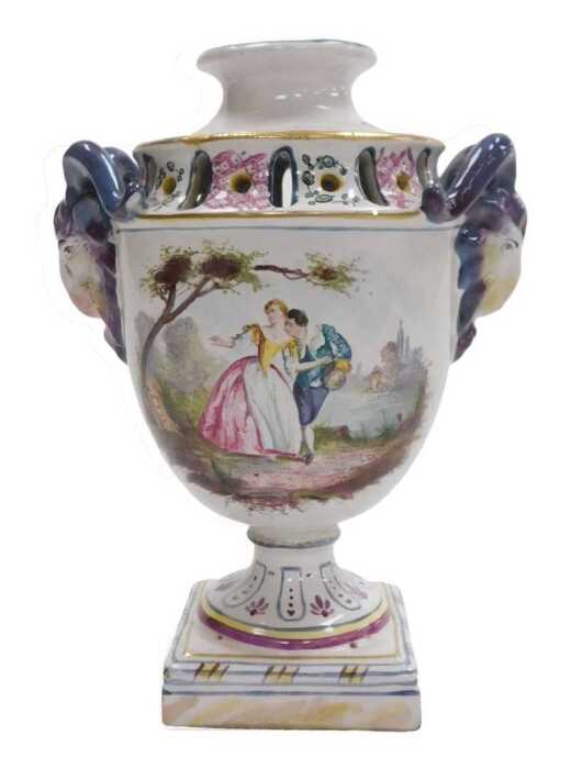 A late 18thC Veuve Perrin pottery vase, with ram's head handles, painted with a fete gallant and...