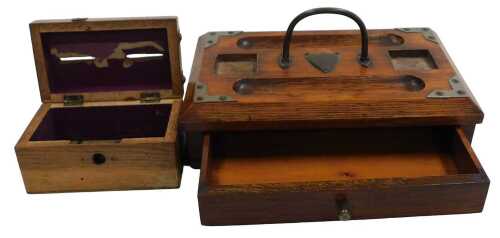 A Victorian oak deskstand, inkwells lacking, with a single frieze drawer, raised on bun feet,...
