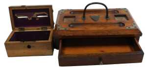 A Victorian oak deskstand, inkwells lacking, with a single frieze drawer, raised on bun feet,...