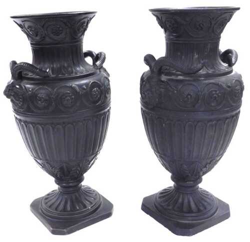 A pair of late 19thC Continental black basalt vases, of twin ram's head handle, semi fluted form,...