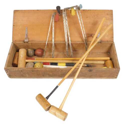 A croquet set, pine boxed, 103cm wide.