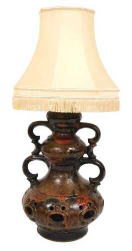 A mid century West German pottery lava lamp, of double handled form, with shade, 78cm high.