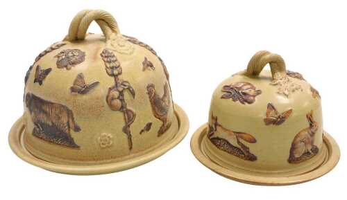 Two Martin Homer pottery cheese dishes and covers, sprig moulded with birds, animals, fruit, etc....