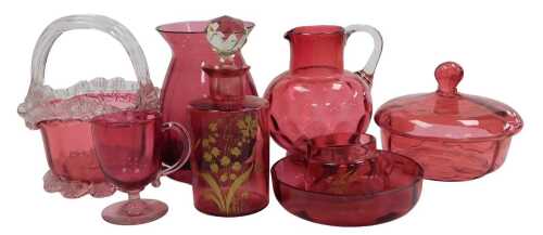 A group of Victorian and later cranberry glass, including a basket, water jug, powder bowl and...