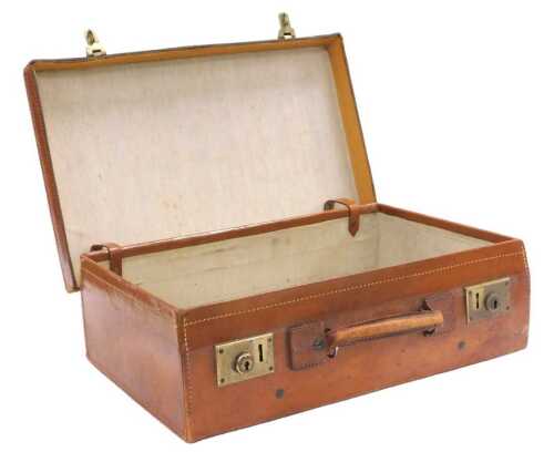 An early 20thC tan leather suitcase, 56cm wide.