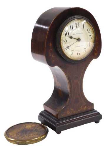An Edwardian mahogany cased balloon mantel clock, by JM Johnson of Huddersfield, circular white...