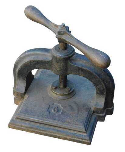 A cast iron book press, numbered 6, 36cm high.
