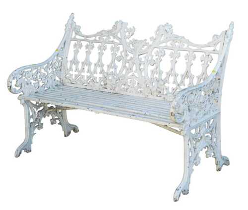 A Coalbrookdale style |Gothic white painted cast iron garden bench, with pierced rosette and...