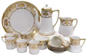 A Noritake porcelain part coffee service, gilt and yellow painted with baskets and sprigs of...