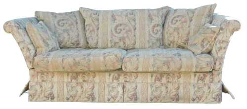 A Knoll type drop arm two seater sofa, upholstered in a scrolling fruit pattern fabric, 210cm wide.