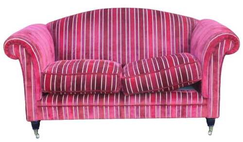 A contemporary two seater sofa, upholstered in red and raspberry pink velvet striped fabric,...