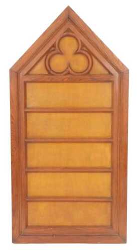A Victorian Gothic pine church hymnal board, of arched form, with five hymn number receptacles,...