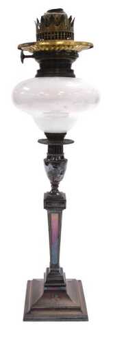 A late 19thC Young's silver plated oil lamp, of Adam style candlestick form, crest engraved,...