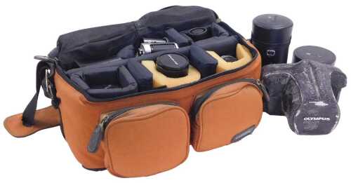 An Olympus OM-2 camera, with an auto zoom and other lens, case, flash, etc., some with boxes and...