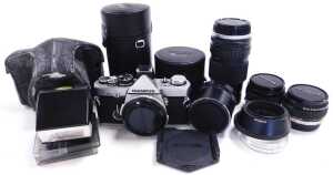 An Olympus OM-2 camera, with an auto zoom and other lens, case, flash, etc., some with boxes and... - 2