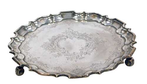 An Edward VII silver piecrust salver, with engraved floral and foliate decoration, central...