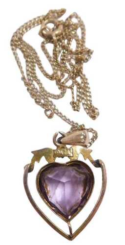 An Edwardian amethyst and seed pearl pendant, the heart shaped amethyst in an openwork frame,...