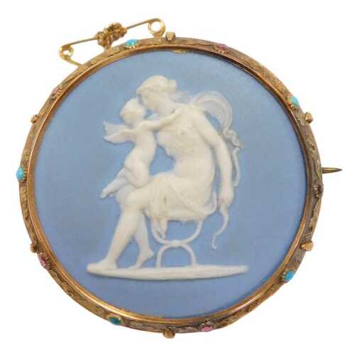 A Wedgwood light blue Jasper circular brooch, in a yellow metal frame set at intervals with...