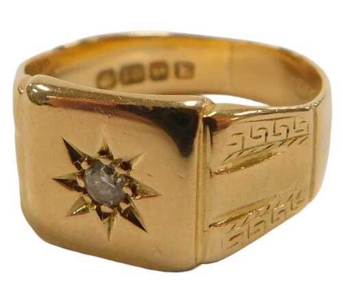 An 18ct gold signet ring, star set with a solitaire diamond, size P, 6.6g.